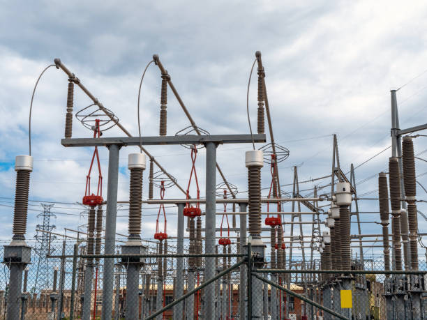 a view of an electric power station under grey cloudy sky