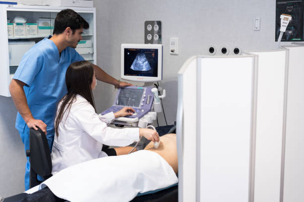 istock Doctor examining patient with ultrasound scan 1432802430