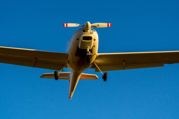 istock Single-propeller plane landing from a nose-down view centred in the picture. 1432804484