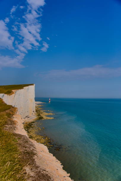 istock Landscape image of Beachy Head Cliffs, adjacent coastline and lighthouse. 1432806631