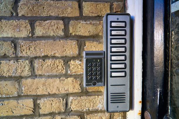 istock Door entry system and buzzers for each flat on a brick wall. 1432809981