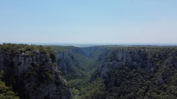 istock Scenic valley with lush green vegetation 1432809999
