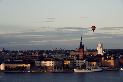 A beautiful aerial view of Riddarholmen in Stockholm, Sweden with a hot air balloon in the sky