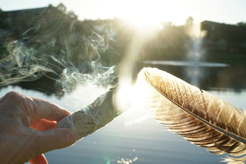 smudging sage and cleansing the soul with a feather