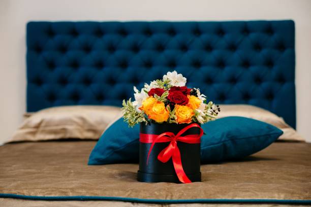 istock Closeup of a floral arrangement in a box on a bed 1432811193