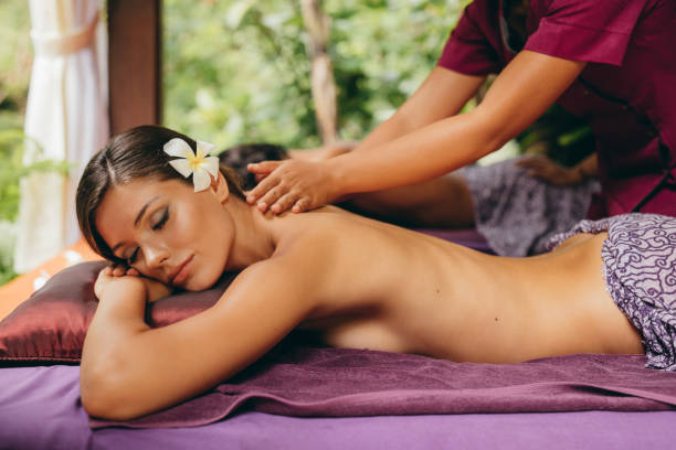 istock Serene young woman getting a full body massage at a spa resort 1432812764