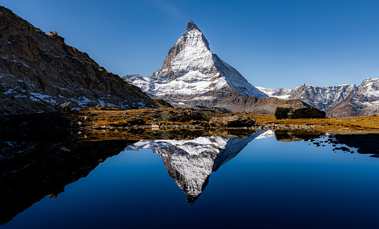 Perfect reflection of Matterhorn in the Riffelsee during fall