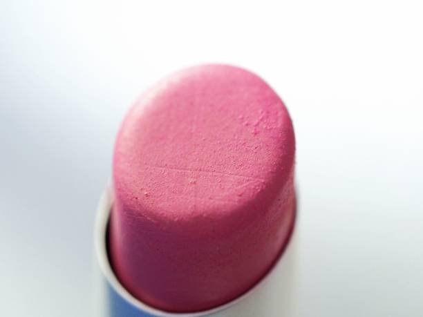 Closeup macro view of pink bullet lipstick