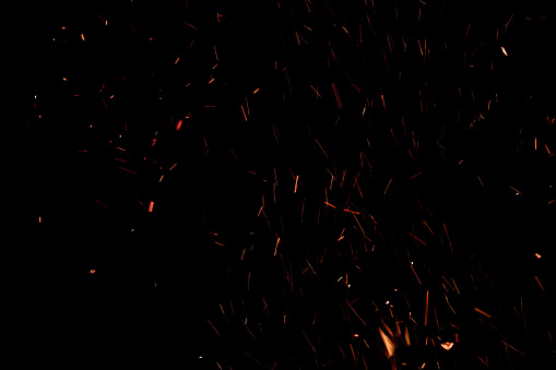flames of darkness float in the air. sparks bonfire on a black background
