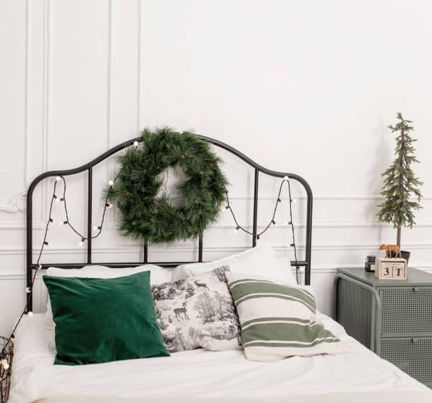 istock Bedroom interior with bed decorated Christmas tree 1432821538