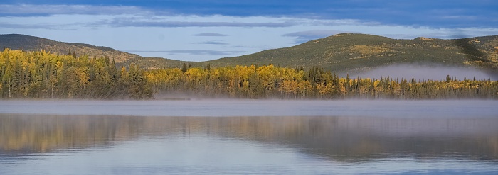 Yukon in Canada, wild landscape in autumn, reflection in a lake
