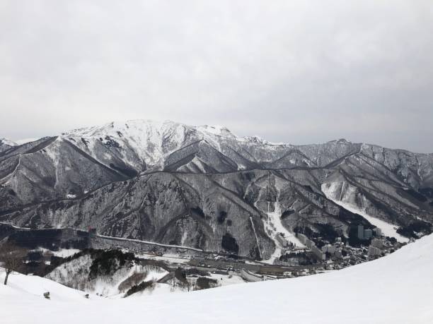 istock Monochrome of snow-covered mountains on a cloudy day 1432822589