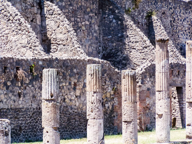 Carved pillars inside the amphitheatre at Pompeii, Italy