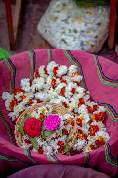 istock Bowl of colorful flower petals for celebration, vertical 1432829488