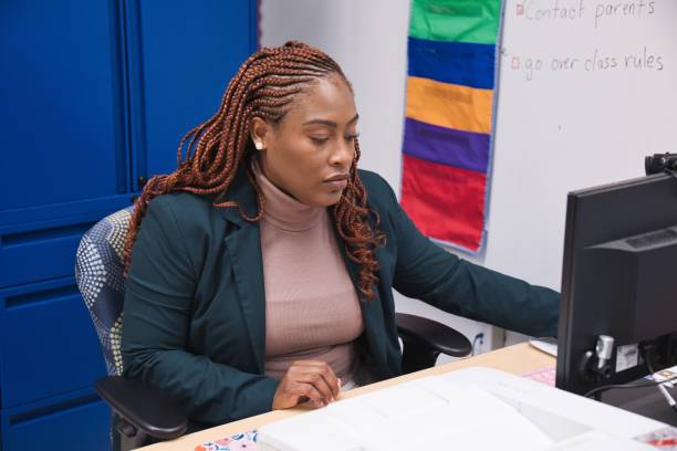 istock Confident African-American teacher in his office preparing for class 1432830890