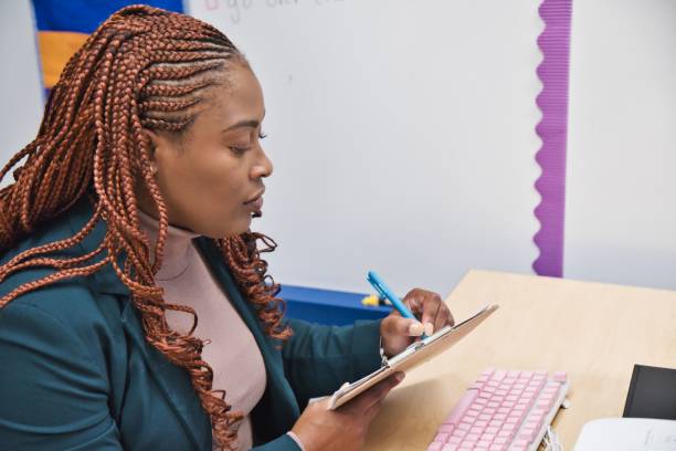 istock Confident African-American teacher in his office preparing for class, 1432830903