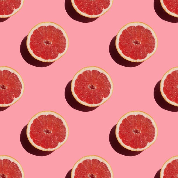 istock seamless pattern of fresh ripe grapefruit with a shadow on a pink background 1432831705