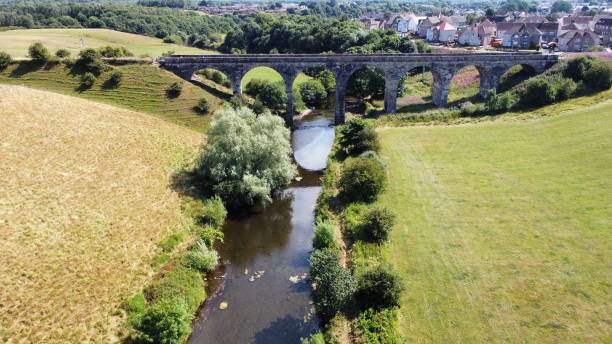 istock Aerial view over the Kilmacthomas Viaduct bridge on river and green fields, Ireland 1432832098