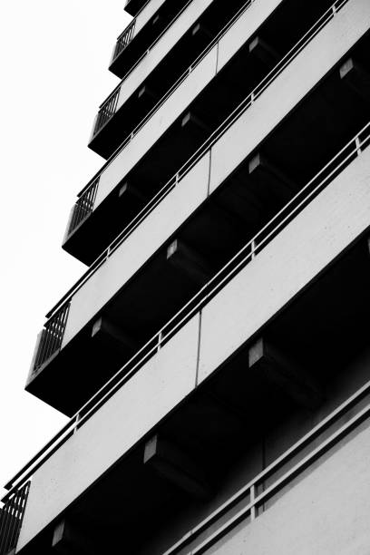 istock Vertical low angle shot of a gray building with long balconies 1432832174