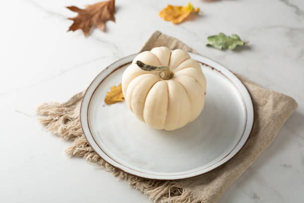 istock Close up of Autumn concept empty plate and white pumpkin 1432832676