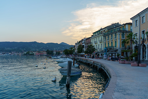 Salò, Lombardy, Italy - July 22, 2022: On the banks of Lake Garda, Salò is a city and comunity in Brescia, Lombardy. It has the longest promenade along the lake. It was in this city that the Italian Social Republic was based from 1943 to 1945, often referred to as the \
