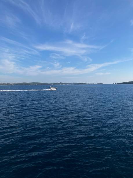 istock Vertical shot of a yacht driving on a lake 1432838521