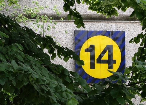 wall of an exhibition hall with sign number 14