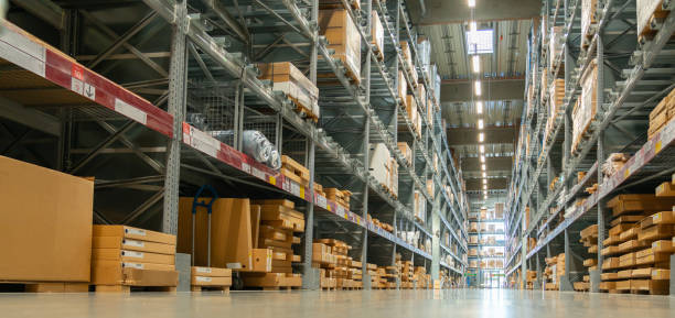 istock Panoramic view of a large warehouse in the aisle between shelves and racks 1432840638