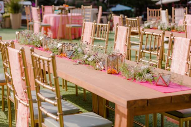 istock Wedding decorations for the ceremony in flowers on green background, candles, and tableware 1432840905
