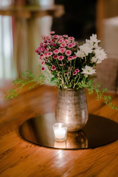 istock Wedding decorations for the ceremony in flowers on green background, candles, tableware 1432840933