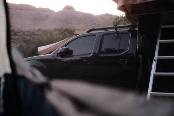 istock Black car in camping set up 1432841667