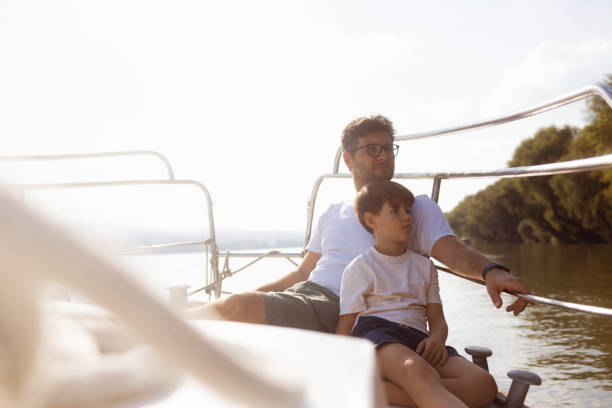 istock Father and son enjoying a day on the water 1432842810