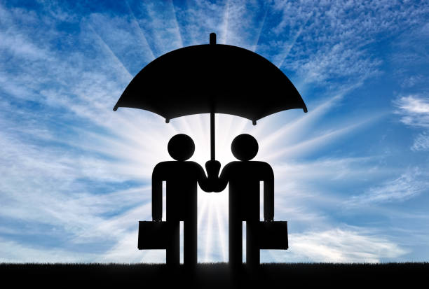 two icons of little men stand under umbrella together - umbrella men business businessman imagens e fotografias de stock