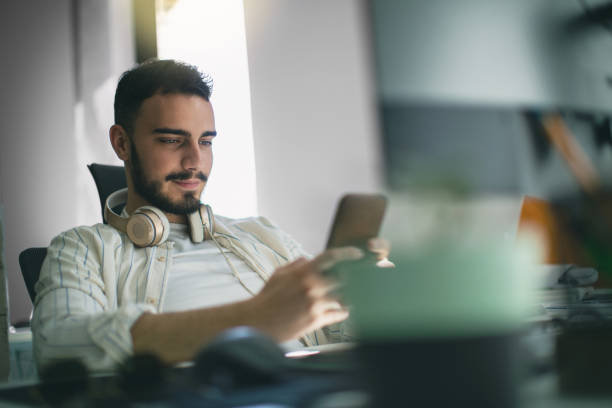 Man At Desk With Multiple Screens Stock Photos, Pictures & Royalty-Free ...