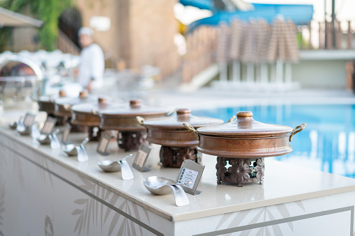 Buffet with Turkish delicious food by the beautiful blue pool travel in resort