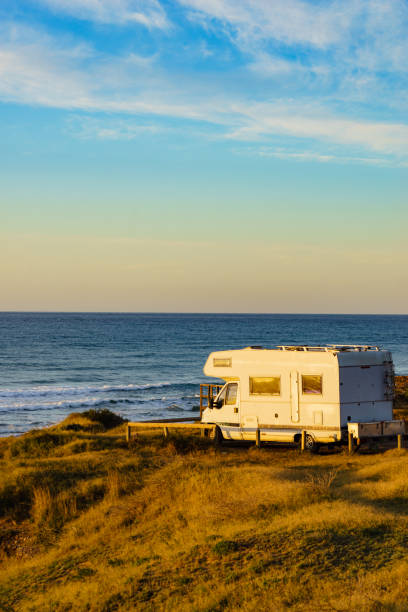istock Camper rv camping on sea shore, Spain 1432846957