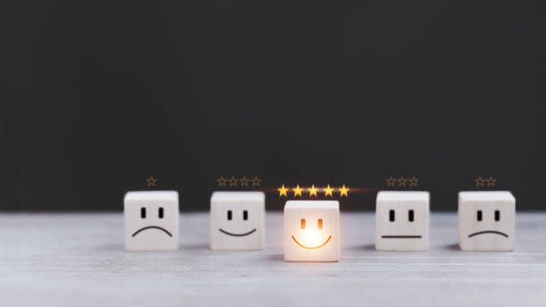 istock customer services best excellent business rating experience. Satisfaction survey concept. Hand of a businessman chooses a smiley face on wood block cube. 5 Star Satisfaction 1432847926