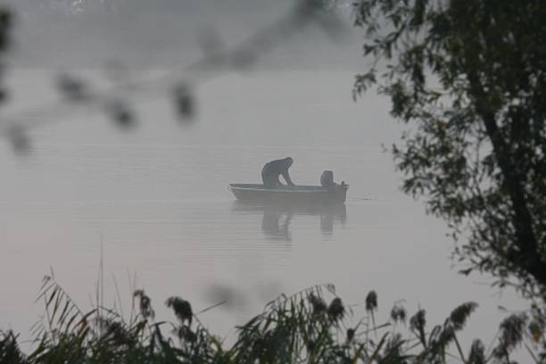 istock Fishing boat in morning mist 1432850396