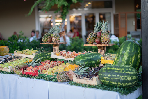 local neighborhood fresh summer fruit market with colorful organic fruit on display in crete greece