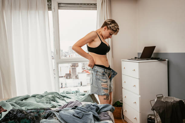 istock Millennial woman dressing up at home 1432851560