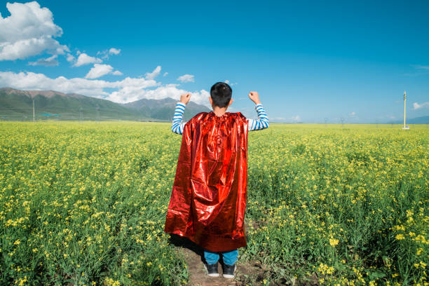 istock Young superman showing muscles towards oilseed rape 1432854286