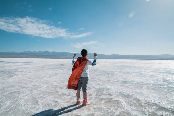 istock Young superman showing muscles towards  salt lake 1432854571