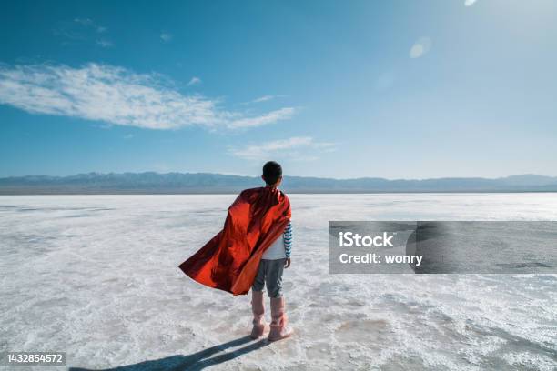 Young Superman Looking And Contemplating Towards Salt Lake Stock Photo - Download Image Now
