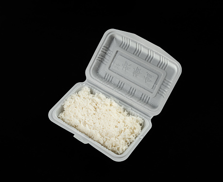 Rice in bento box on black background