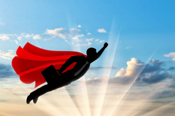 istock Superhero businessman flies in the sky 1432856051
