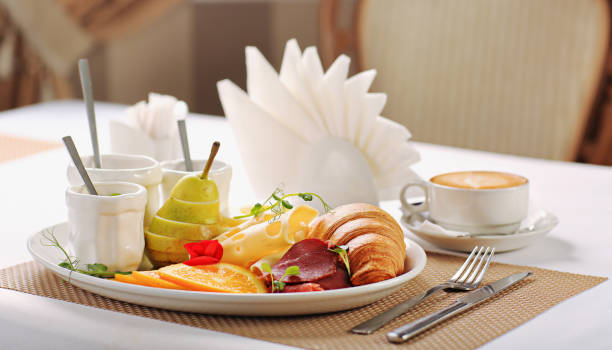 istock Delicious breakfast with coffee, croissants, jam. Hearty continental breakfast 1432859192