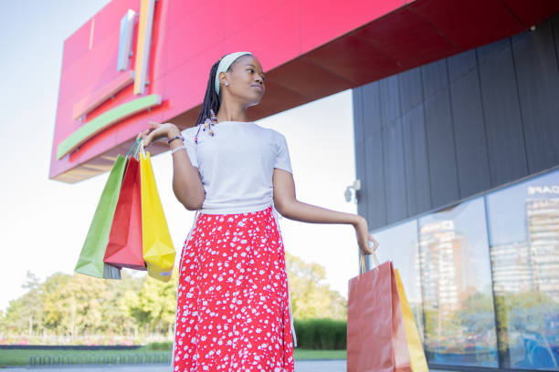 istock Young woman coming back from shopping 1432860838