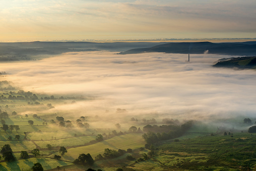 Wide angle view of sunrise along The Great Ridge with Edale and Hope Valley. Peak District National Park, England, UK.