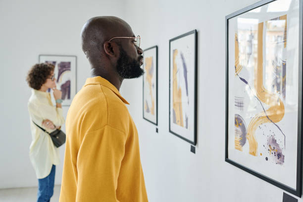istock People visiting art exhibition at gallery 1432867043