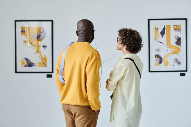 istock Multiethnic couple standing at art gallery 1432867044